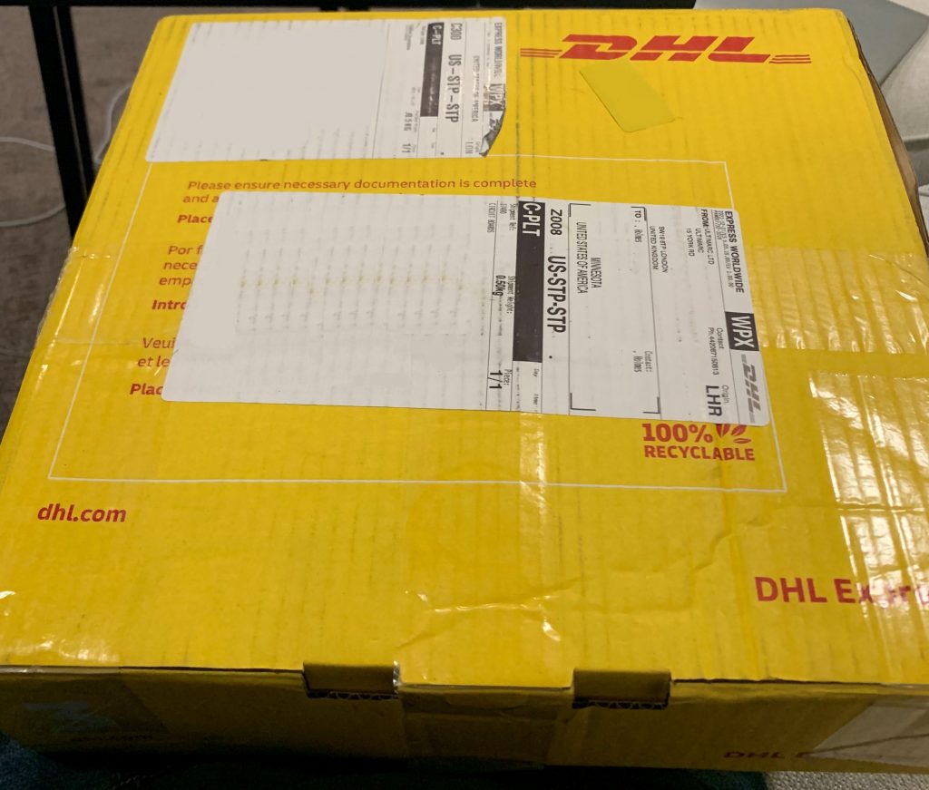 Photo of DHL box with arcade controls inside