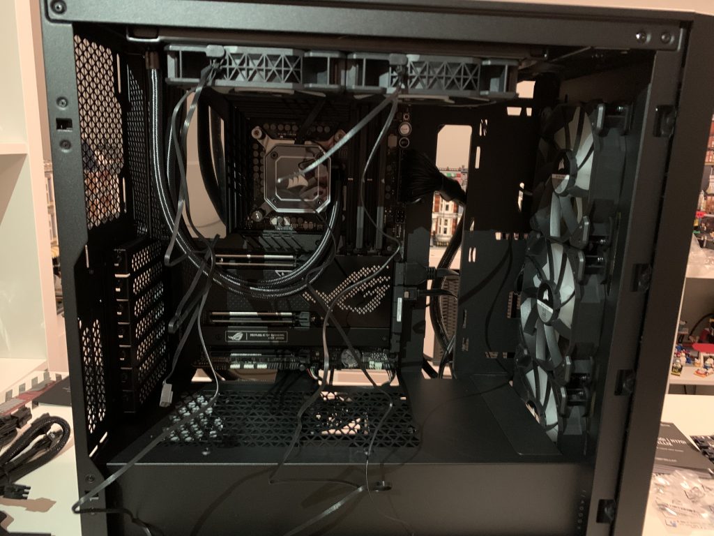 Photo of computer case with power supply cables strewn everywhere now that power supply is installed