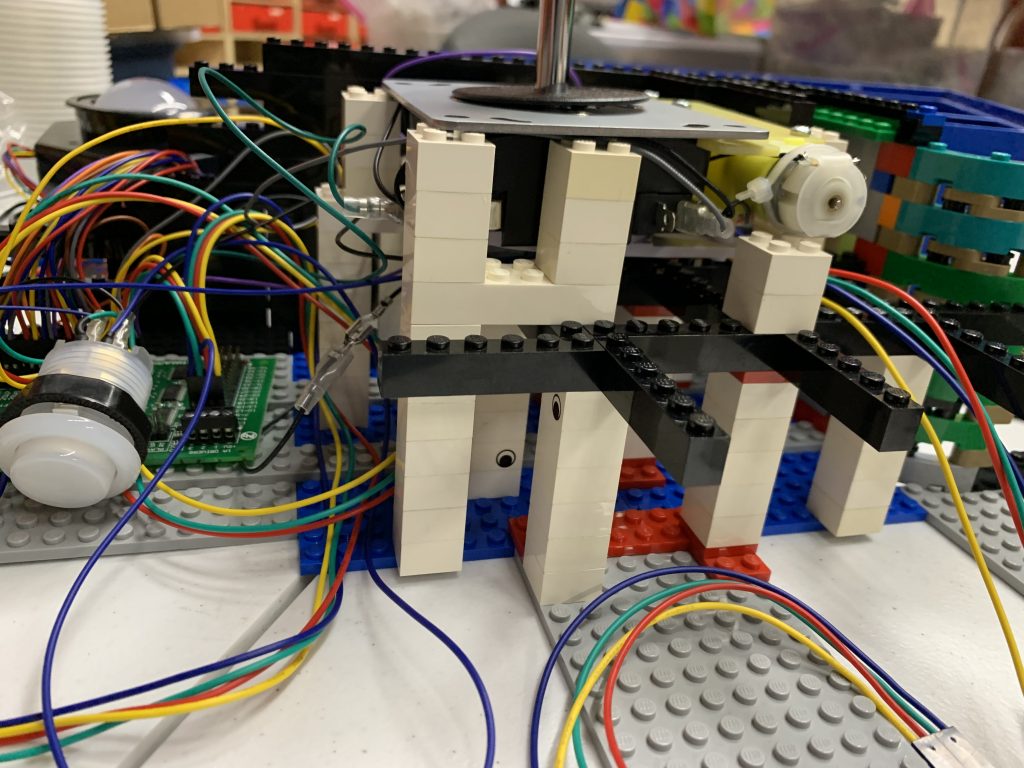 Photo showing side view of the joystick resting on top of the internal control panel structure.