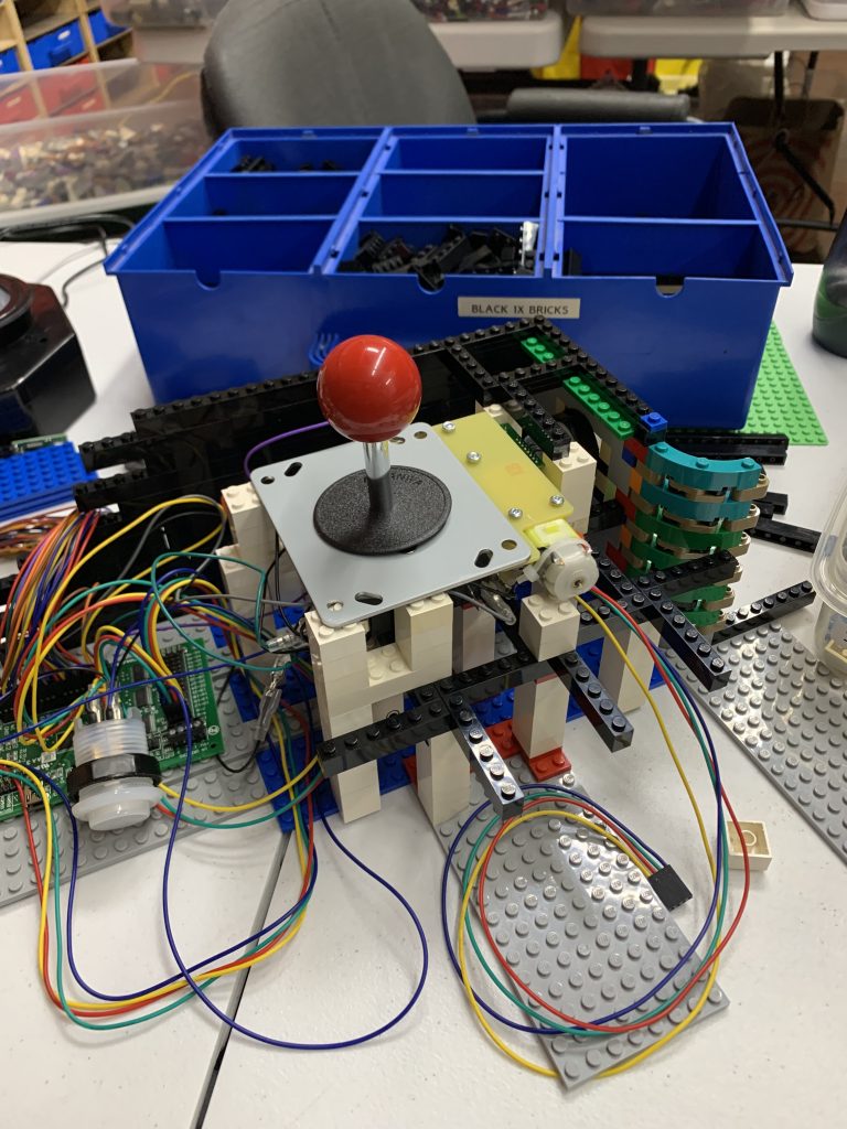 Photo showing top-down view of the joystick resting on top of the internal control panel structure.