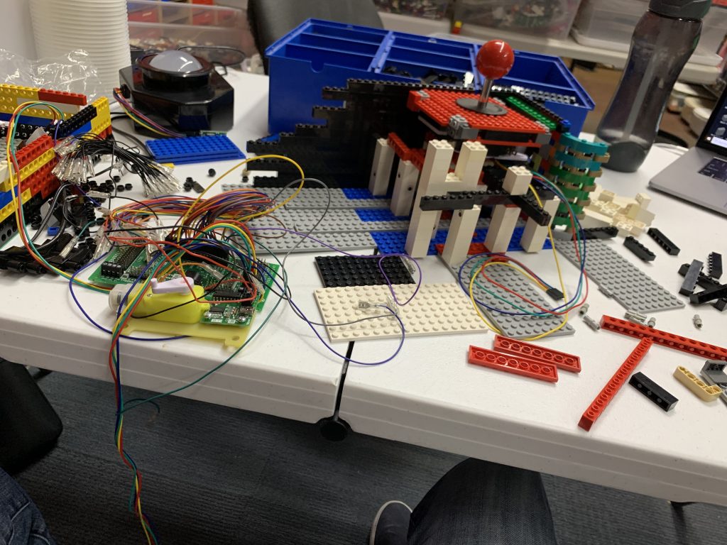 Photo showing the prototype of the control panel with the button and joystick installed.