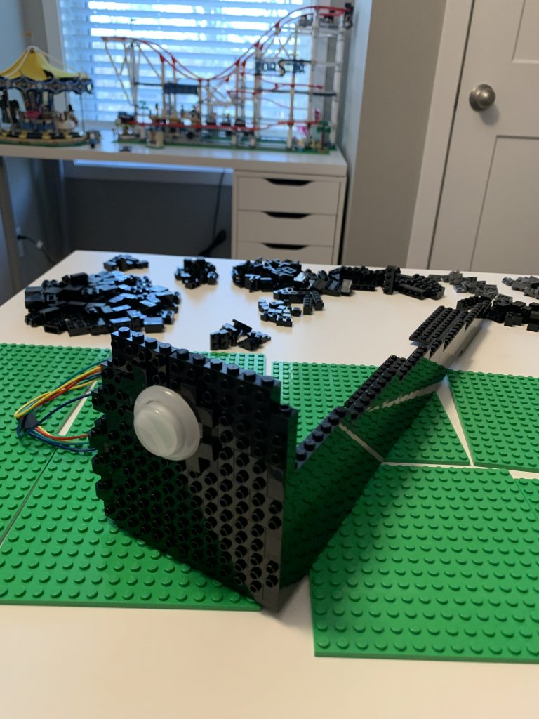 Photo showing the left corner and left flipper of player one in the partially assembled control panel.