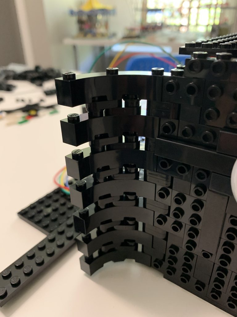 Photo showing the linked parts put in place and producing a curve in the front of the control panel.