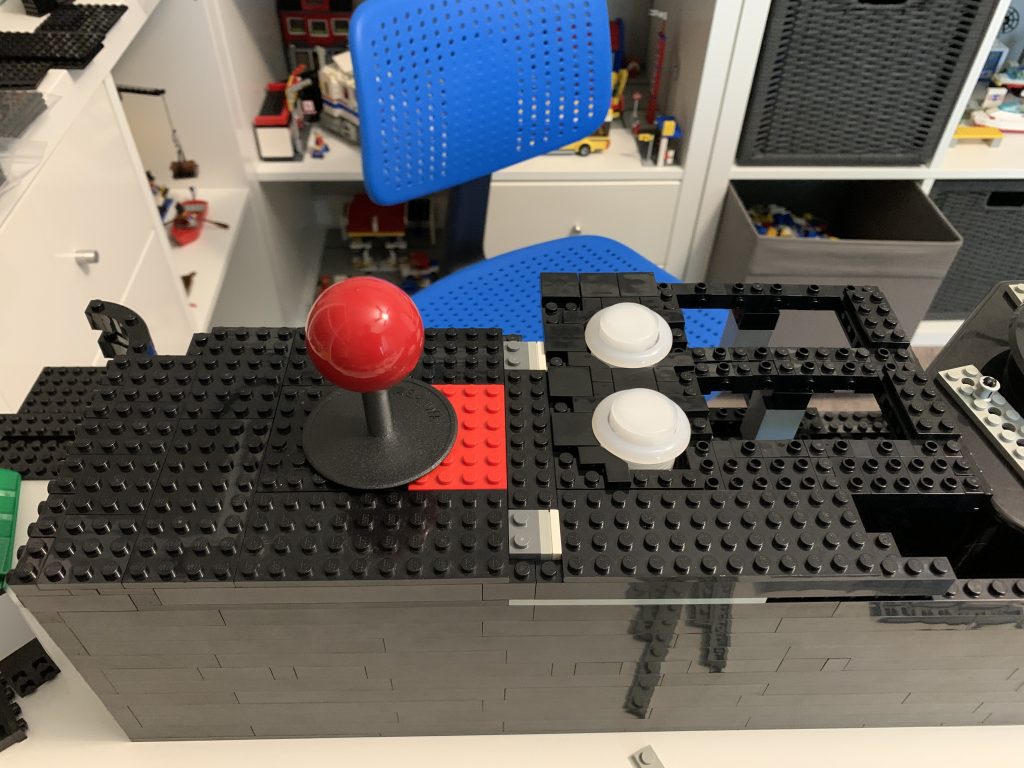 Photo showing the button panel with tiles added to it for visual and sensory appeal.