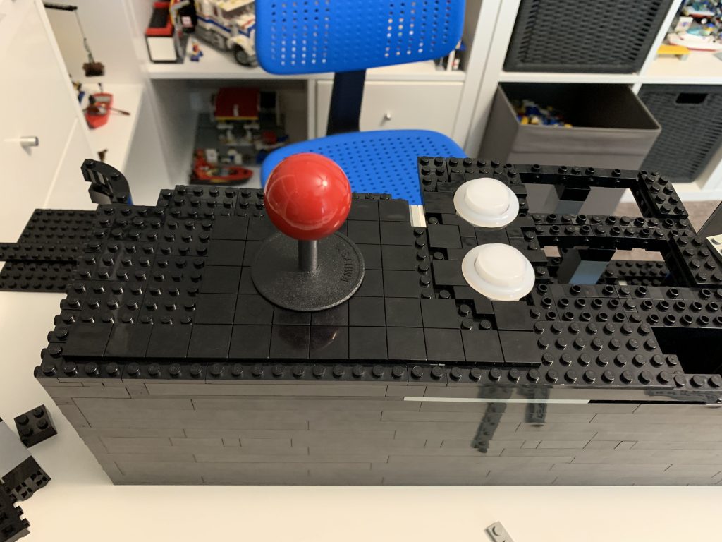 Photo showing tiles now added around the player 1 joystick as well.