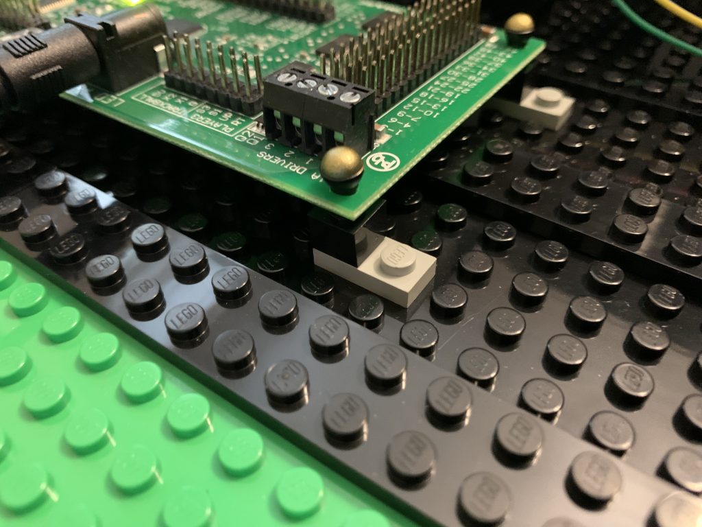 Photo showing LEGO microphone plugged into LEGO Brick below on other side of circuit board
