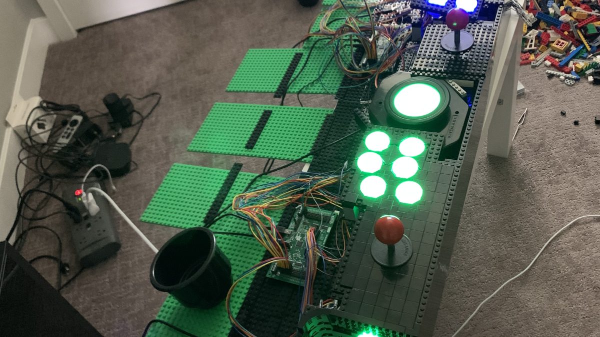 Photo of control board with player 1 and player 2 controls lit up and connected