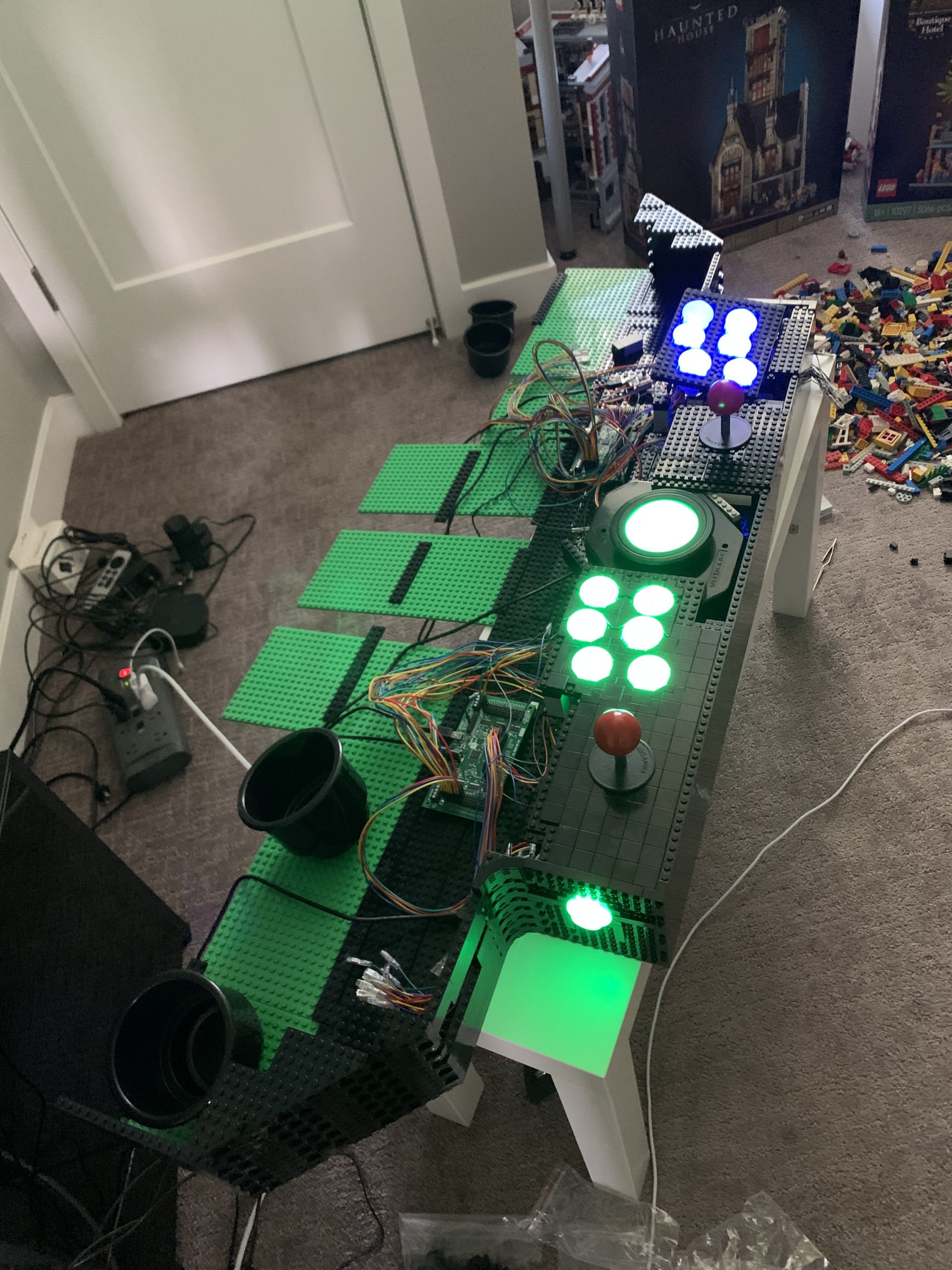 Photo of control board with player 1 and player 2 controls lit up and connected