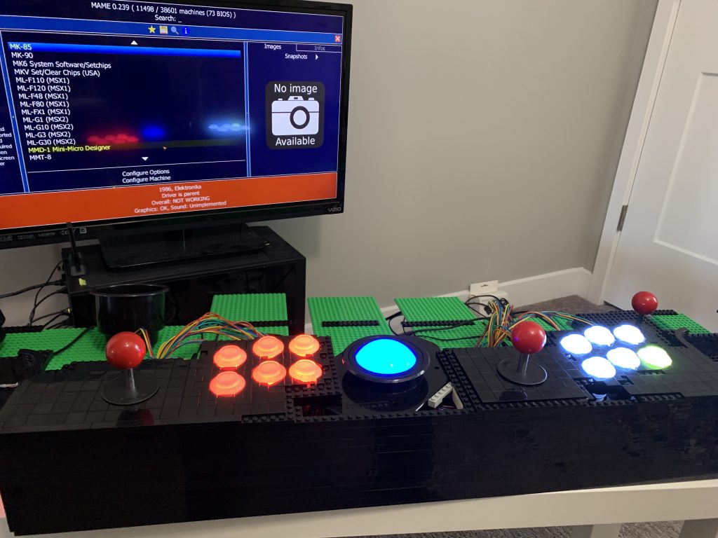 Photo showing player 1 and player 2 controls fully operational along with the trackball after the wiring nightmare.