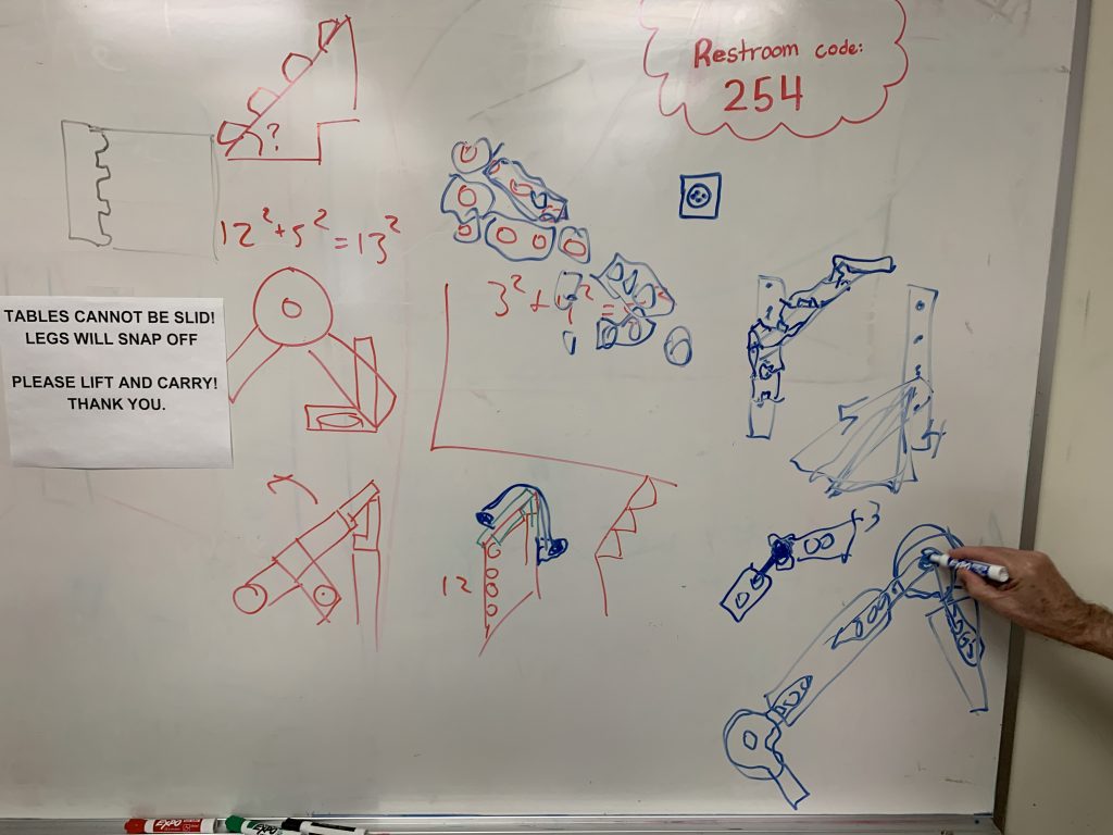Whiteboard sketches of ideas of how to make angles using LEGO® brick