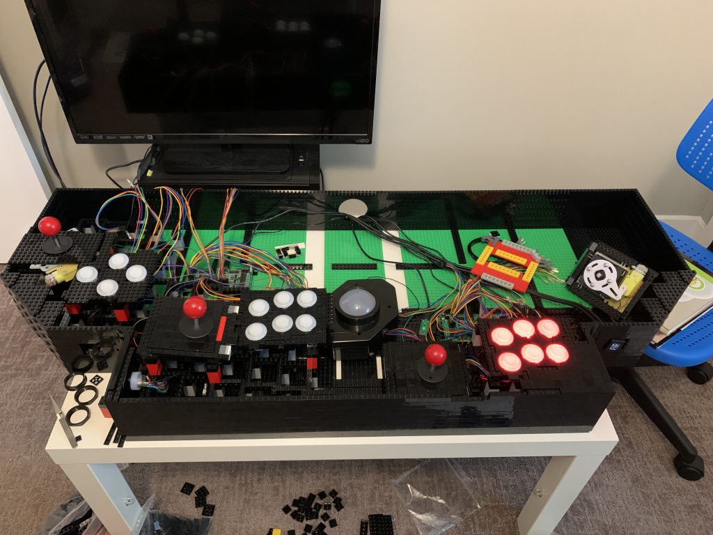 Photo of the control panel in full view with player 3 joystick and buttons installed