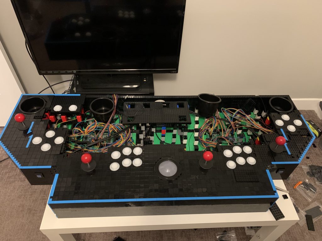 Photo of control panel with front portion tiled up and blue neon tiles surrounding the front and side borders.