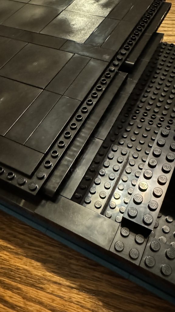 Photo showing the bin base sitting on tile from top-down - tiled as it will be a box to store coins