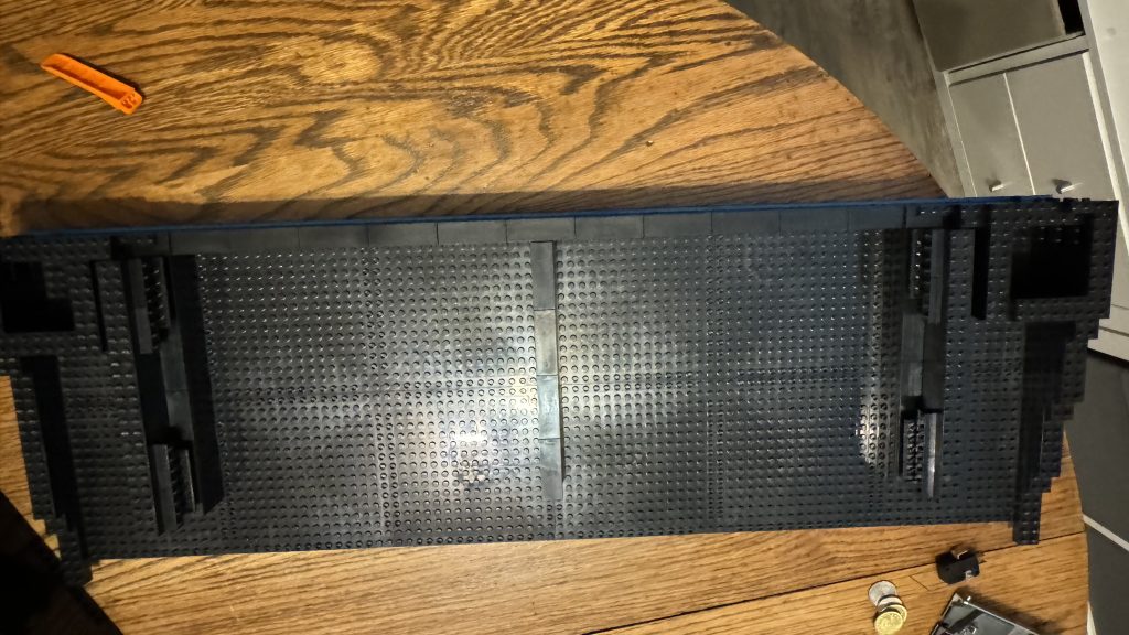 Photo showing support built to hold the bin in place