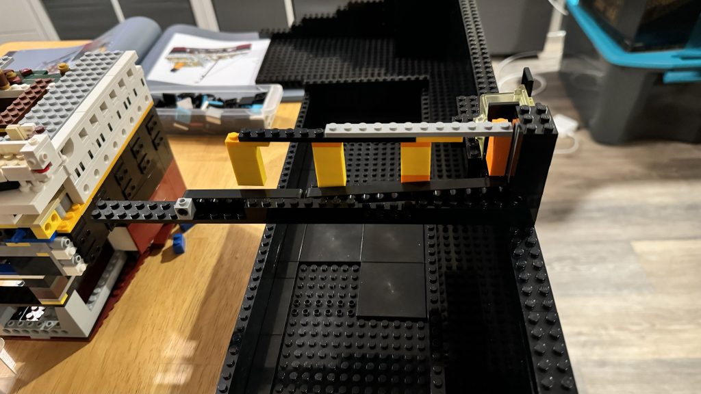 Picture showing the side of a third iteration of the coin chute built from LEGO®.