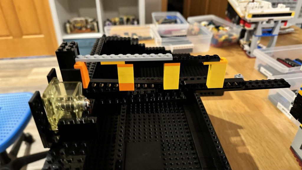 Another photo of the side of the coin chute, but from the other side of it