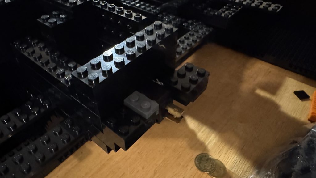 Photo showing the switch installed in between a bunch of brick