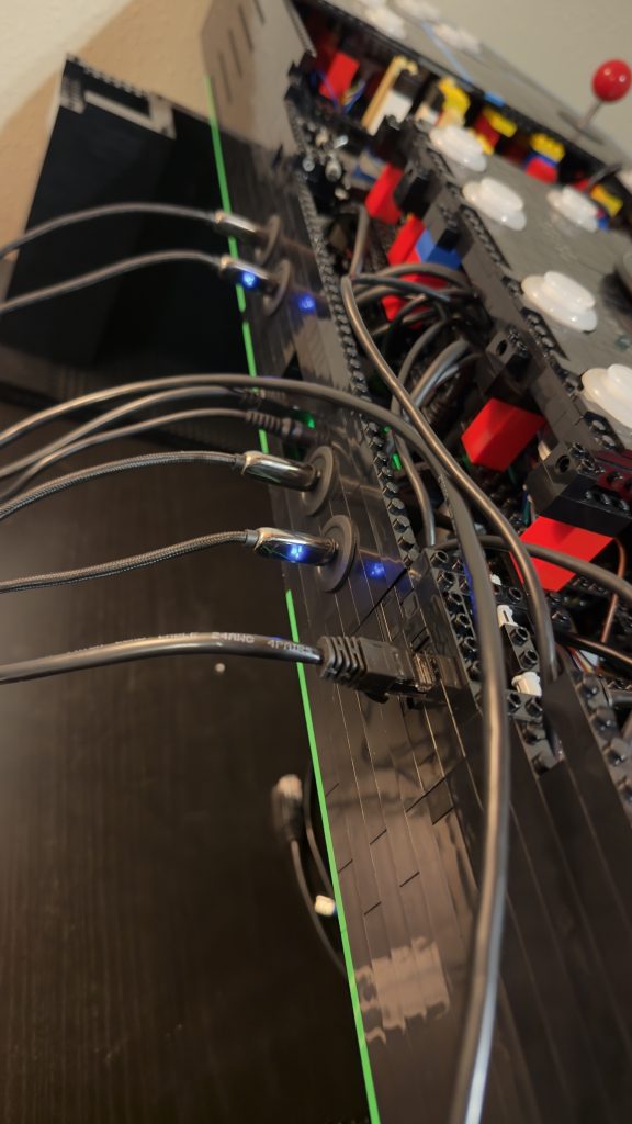 Photo showing a bunch of wires sticking out of the back of the control panel