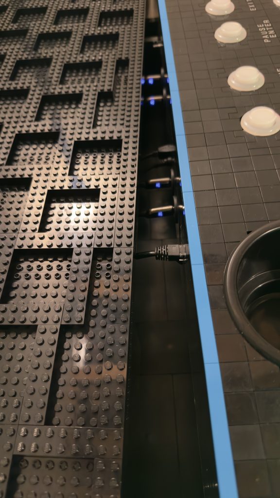 Photo showing the edge of the base just fitting over the cables coming out of the control panel. Nicely cleared!