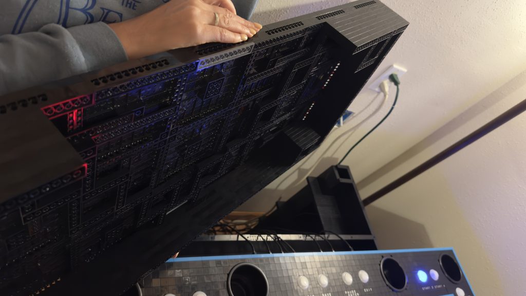 Photo showing brick built below the display base, demonstrating cut out section for cables from control panel