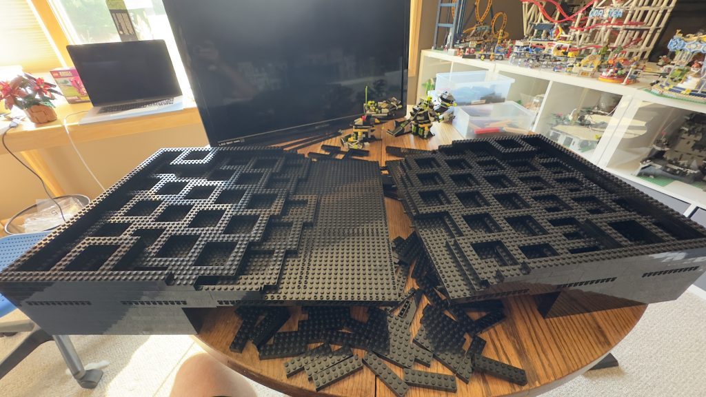 Base torn apart in two with big video screen sitting behind it