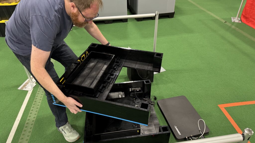 Setting up - placing the coin bin on top of the base