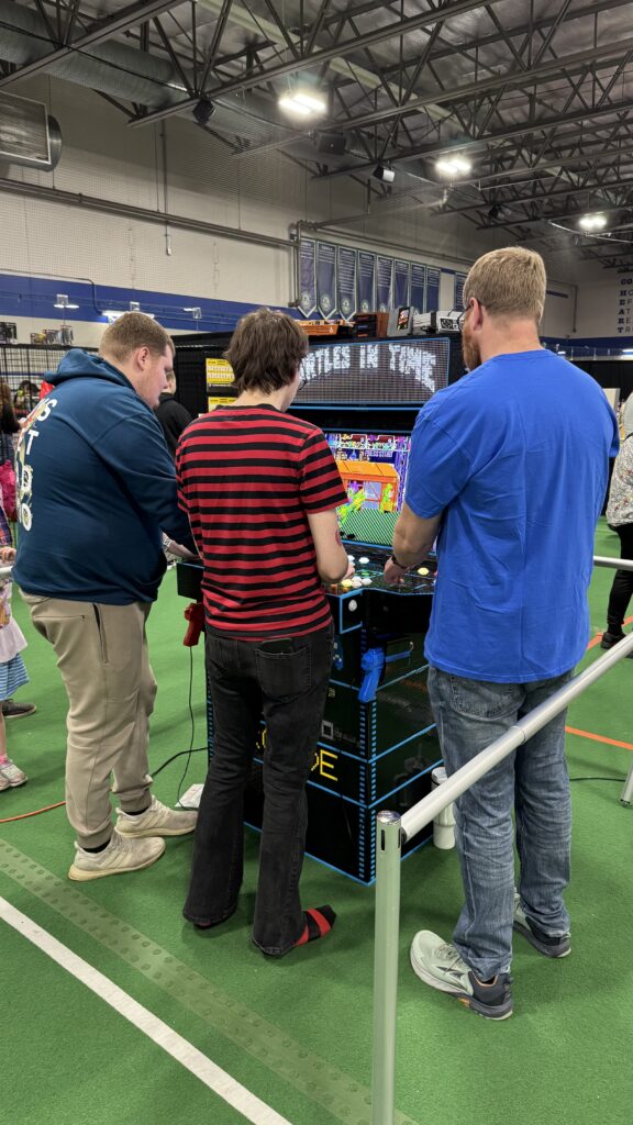 People playing the arcade