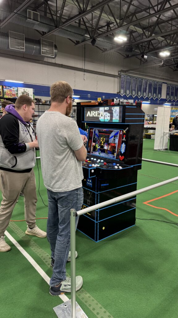 People playing the arcade